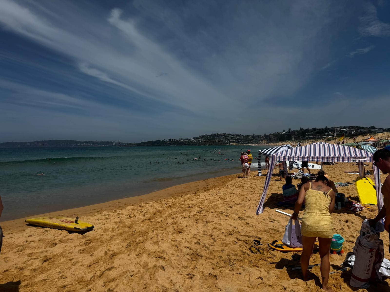 Curl Curl beach — blue sky with white cloud streaks, Northern Beaches Sydney